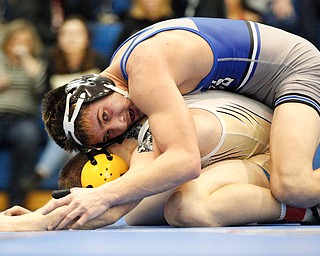 Jackson Milton's Anthony Pizzuto tries to pin down Crestview's Isaac Ricketts during the Jackson-Milton Invitational finals on Saturday. EMILY MATTHEWS | THE VINDICATOR