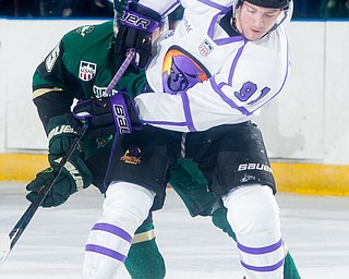 Scott R. Galvin | The Vindicator.Youngstown Phantoms forward Connor MacEachern (91) battles past Sioux City Musketeers forward Marus Kallionkieli (15) for the puck during the first period at the Covelli Centre on Saturday, January 5, 2019.