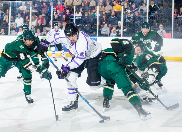 Scott R. Galvin | The Vindicator.Youngstown Phantoms forward Brett Murray (21) reaches for a rebound between Sioux City Musketeers forward Matt Miller (9) and defenseman Luke Johnson (3) during the first period at the Covelli Centre on Saturday, January 5, 2019.