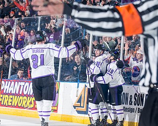 Scott R. Galvin | The Vindicator.Youngstown Phantoms forwards Brett Murray (21), Jack Malone (18) and Ben Schoen (19) congratulate Connor MacEachern on his second period goal against Sioux City Musketeers as the referee signals for a goal at the Covelli Centre on Saturday, January 5, 2019.