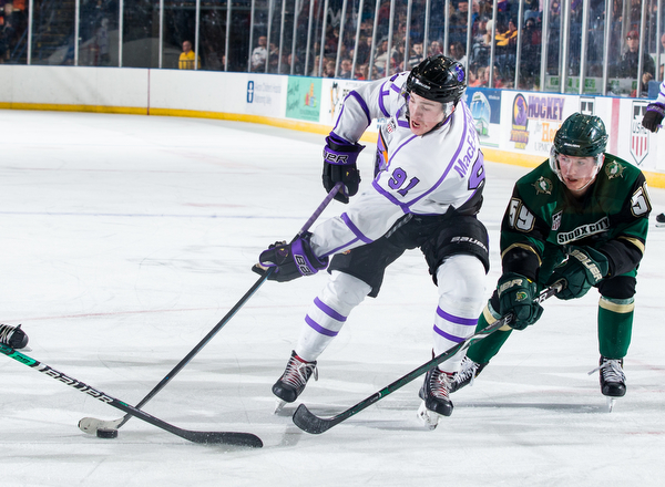 Scott R. Galvin | The Vindicator.Youngstown Phantoms forward Connor MacEachern (91) skates the puck past Sioux City Musketeers forward Ian Malcolmson (59) during the second period at the Covelli Centre on Saturday, January 5, 2019.