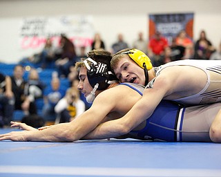 Crestview's Isaac Ricketts tries to pin down Jackson Milton's Anthony Pizzuto during the Jackson-Milton Invitational finals on Saturday. EMILY MATTHEWS | THE VINDICATOR