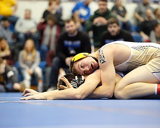 Crestview's Isaac Ricketts tries to pin down Jackson Milton's Anthony Pizzuto during the Jackson-Milton Invitational finals on Saturday. EMILY MATTHEWS | THE VINDICATOR