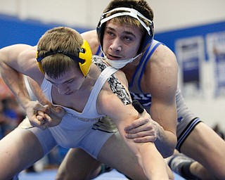 Jackson Milton's Anthony Pizzuto and Crestview's Isaac Ricketts wrestle during the Jackson-Milton Invitational finals on Saturday. EMILY MATTHEWS | THE VINDICATOR