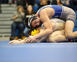 Jackson Milton's Anthony Pizzuto tries to pin down Crestview's Isaac Ricketts during the Jackson-Milton Invitational finals on Saturday. EMILY MATTHEWS | THE VINDICATOR