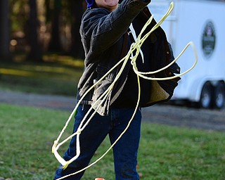 CANFIELD, OHIO - JANUARY 5, 2019: Kyle Ramhoff throws a line during an ice rescue station, Saturday morning at Camp Stambaugh. DAVID DERMER | THE VINDICATOR