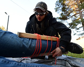 CANFIELD, OHIO - JANUARY 5, 2019: Nick Martin has his leg placed in a make shift spent by Austin Ladd, back, Saturday morning at Camp Stambaugh. DAVID DERMER | THE VINDICATOR