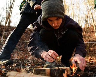 CANFIELD, OHIO - JANUARY 5, 2019: Nick Usis from Canfield works on starting a fire, Saturday morning at Camp Stambaugh. DAVID DERMER | THE VINDICATOR