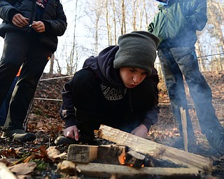 CANFIELD, OHIO - JANUARY 5, 2019: Nick Usis from Canfield works on starting a fire, Saturday morning at Camp Stambaugh. DAVID DERMER | THE VINDICATOR