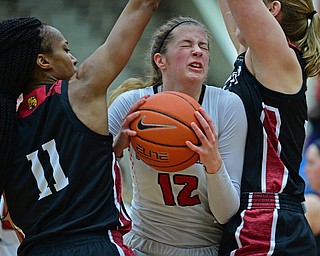 YOUNGSTOWN, OHIO JANUARY 5, 2019: Youngstown State's Chelsea Olson attempts to split the IUPUI defense of Tamya Sims, left, and Morgan Allen during the first half of their game, Saturday afternoon at Beeghly Center. Youngstown State won 70-52. DAVID DERMER | THE VINDICATOR