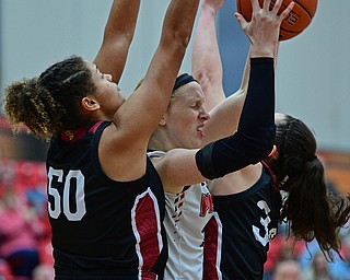 YOUNGSTOWN, OHIO JANUARY 5, 2019: Youngstown State's Sarah Cash looks to pass the ball while being pressured by IUPUI's Macee Williams, left, and Katelyn O'Reilly during the second half of their game, Saturday afternoon at Beeghly Center. Youngstown State won 70-52. DAVID DERMER | THE VINDICATOR