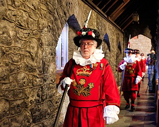 The beefeaters walk down the church aisles during the Boar's Head and Yule Log Festival at St. John's Episcopal Church on Sunday afternoon. EMILY MATTHEWS | THE VINDICATOR