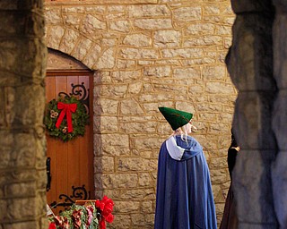 One of the waits stands near the front of the church during the Boar's Head and Yule Log Festival at St. John's Episcopal Church on Sunday afternoon. EMILY MATTHEWS | THE VINDICATOR