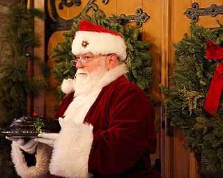 Father Christmas walks into the church during the Boar's Head and Yule Log Festival at St. John's Episcopal Church on Sunday afternoon. EMILY MATTHEWS | THE VINDICATOR