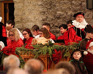 The boar's head is displayed on an alter during the Boar's Head and Yule Log Festival at St. John's Episcopal Church on Sunday afternoon. EMILY MATTHEWS | THE VINDICATOR