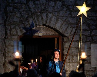 A star is illuminated in the church during the Boar's Head and Yule Log Festival at St. John's Episcopal Church on Sunday afternoon. EMILY MATTHEWS | THE VINDICATOR