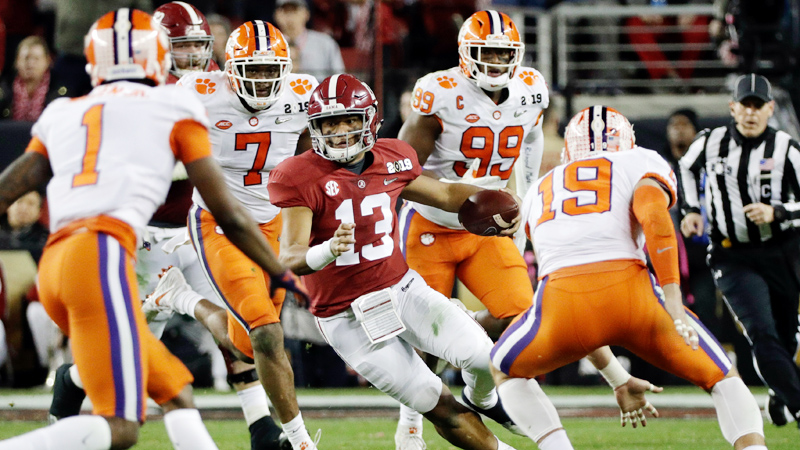 Heisman Trophy runner-up Tua Tagovailoa, 13, from Alabama tries to elude several Clemson Tiger defenders during the College Football Playoff national championship game at Levi's Stadium in Santa Clara, Calif. The Tigers crushed the Crimson Tide 44-16 on Monday night to win its second national championship in three years and handed Crimson Side Coach Nick Saban his most lopsided defeat.