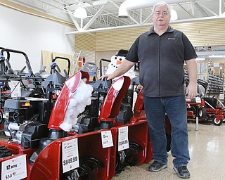 Jay Curry, manager of Do-Cut Sales & Services in Boardman, says it's been a challenge to sell snow blowers because of the Mahoning Valley's lack of snow so far this winter season.