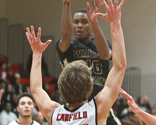 William D. Lewis The Vindicator  Harding's D'Muntzie Owens(10) lover Canfield's Kyle Gamble (24)  during 1-8-19 action at Canfield.