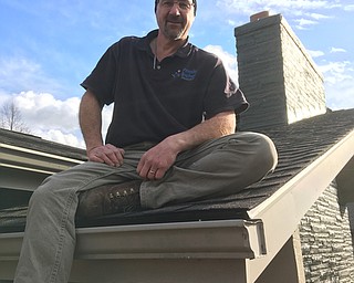 .Done Petrosky of Petrosky Brothers construction of Cortland was on the roof of this house working on the chimney when this mornings tornado blew through on Lakeshore Drive in Bazetta Township. Petrosky ducked behind the chimney and rode out the storm which she said lasted about One minute. Storm blew shingles off the roof, so he got a generator and shingles started to repair the roof. power has been off to the neighborhood since just after the storm.