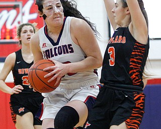 Fitch's Sabria Hunter advances toward the hoop while Howland's Ashley Chambers tries to block her during the first half of their game at Fitch High School on Wednesday night. EMILY MATTHEWS | THE VINDICATOR