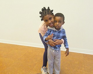 Neighbors | Jessica Harker.A'Miracle Hudson and Sevoy Walker attended the Michael Kusalaba library's Kwanzaa Celebration event.