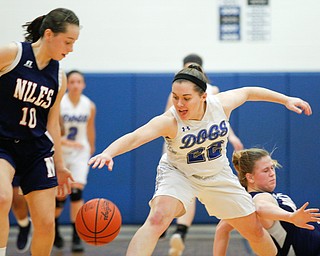 Poland's Kat Partika and Niles' Brandi Baker, left, go after the ball after Niles' Lindsay Hayes, right, falls during their game at Poland on Thursday. EMILY MATTHEWS | THE VINDICATOR