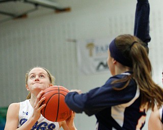 Poland's Ella Harrell looks towards the hoop while Niles' Emma Flanigan tries to block her during their game at Poland on Thursday. EMILY MATTHEWS | THE VINDICATOR