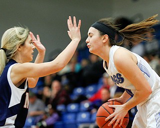 Poland's Elena Cammack looks to pass the ball while Niles' Melody Schuller tries to block her during their game at Poland on Thursday. EMILY MATTHEWS | THE VINDICATOR