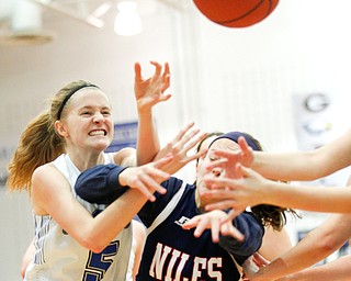 Poland's Ella Harrell tries to catch a rebound during their game against Niles at Poland on Thursday. EMILY MATTHEWS | THE VINDICATOR