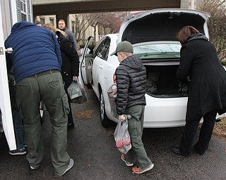 Neighbors | Abby Slanker.Members of Cub Scout Pack 25 helped unload donations to their food drive to benefit Operation Blessing at the Canfield United Methodist Church on Dec. 15.