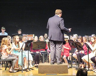 Neighbors | Jessica Harker.Assistant Band Director Jeff Penney directed fifth-grade band students during their first performance on Dec. 12 at Poland Seminary High School.