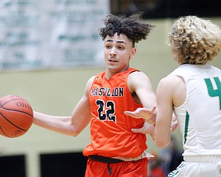 Massillon's Jaiden Wise dribbles the ball while Ursuline's Vince Armeni tries to block him during their game at Ursuline on Friday night. EMILY MATTHEWS | THE VINDICATOR