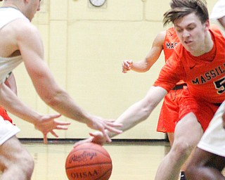 Massillon's Anthony Pedro and Ursuline's Luke Pipala go after the ball during their game at Ursuline on Friday night. EMILY MATTHEWS | THE VINDICATOR