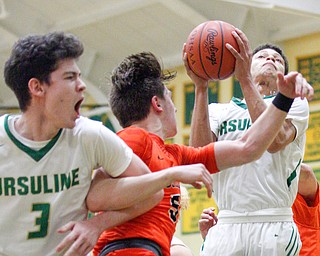 Ursuline's Devon Keevey goes for the hoop during their game against Massillon at Ursuline on Friday night. EMILY MATTHEWS | THE VINDICATOR