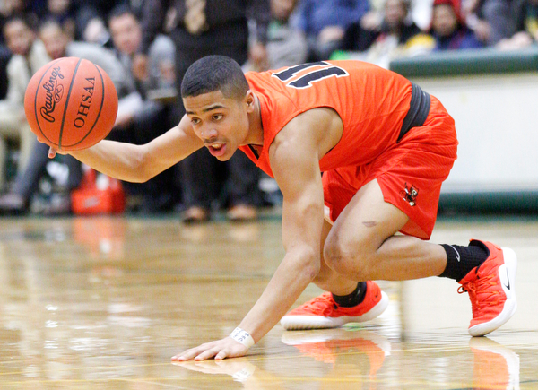 Massillon's Jaden Stock grabs the ball during their game at Ursuline on Friday night. EMILY MATTHEWS | THE VINDICATOR
