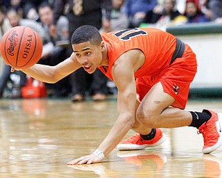 Massillon's Jaden Stock grabs the ball during their game at Ursuline on Friday night. EMILY MATTHEWS | THE VINDICATOR