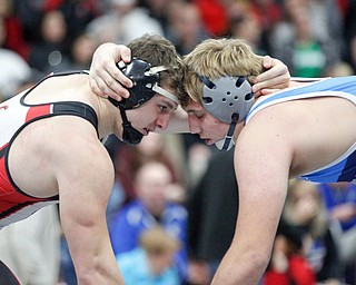 Canfield's Tyler Stein, left, and Louisville's Blake Robbins wrestle during the EOWL wrestling finals at Austintown Fitch High School on Saturday afternoon. Stein placed first in the 220 weight class. EMILY MATTHEWS | THE VINDICATOR