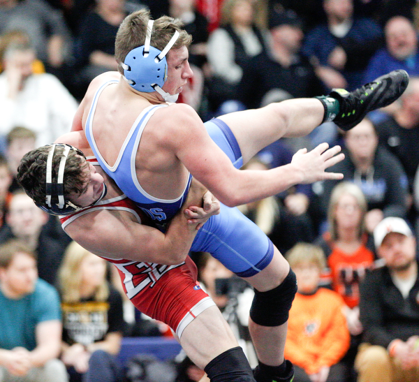 Beaver Local's Logan Ours and Louisville's Davin Rhoads at the EOWL wrestling finals at Austintown Fitch High School on Saturday afternoon. EMILY MATTHEWS | THE VINDICATOR