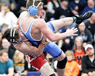 Beaver Local's Logan Ours and Louisville's Davin Rhoads at the EOWL wrestling finals at Austintown Fitch High School on Saturday afternoon. EMILY MATTHEWS | THE VINDICATOR