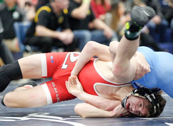 Beaver Local's Logan Ours and Louisville's Davin Rhoads at the EOWL wrestling finals at Austintown Fitch High School on Saturday afternoon. EMILY MATTHEWS | THE VINDICATOR