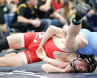 Beaver Local's Logan Ours and Louisville's Davin Rhoads at the EOWL wrestling finals at Austintown Fitch High School on Saturday afternoon. EMILY MATTHEWS | THE VINDICATOR