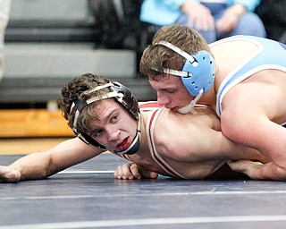 Beaver Local's Logan Ours and Louisville's Davin Rhoads at the EOWL wrestling finals at Austintown Fitch High School on Saturday afternoon. EMILY MATTHEWS | THE VINDICATOR