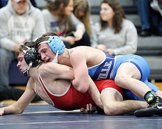 Beaver Local's Logan Ours and Louisville's Davin Rhoads at the EOWL wrestling finals at Austintown Fitch High School on Saturday afternoon. EMILY MATTHEWS | THE VINDICATOR