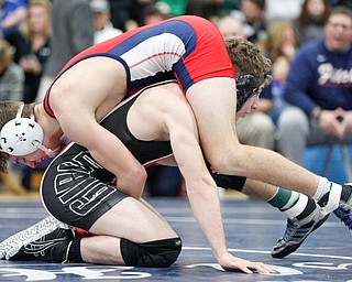 Austintown Fitch's Zach Richards and Girard's Alex Delgarbino at the EOWL wrestling finals at Austintown Fitch High School on Saturday afternoon. EMILY MATTHEWS | THE VINDICATOR