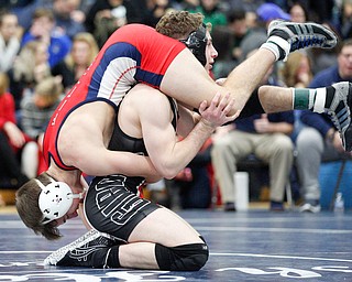 Austintown Fitch's Zach Richards and Girard's Alex Delgarbino at the EOWL wrestling finals at Austintown Fitch High School on Saturday afternoon. EMILY MATTHEWS | THE VINDICATOR