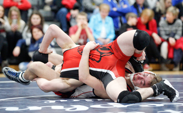Austintown Fitch's Zach Richards, right, and Girard's Alex Delgarbino wrestle during the EOWL wrestling finals at Austintown Fitch High School on Saturday afternoon. Richards placed first in the 132 weight class. EMILY MATTHEWS | THE VINDICATOR