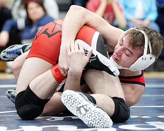 Austintown Fitch's Zach Richards, right, and Girard's Alex Delgarbino wrestle during the EOWL wrestling finals at Austintown Fitch High School on Saturday afternoon. Richards placed first in the 132 weight class. EMILY MATTHEWS | THE VINDICATOR