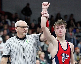 Austintown Fitch's Zach Richards defeats Girard's Alex Delgarbino during the EOWL wrestling finals at Austintown Fitch High School on Saturday afternoon. Richards placed first in the 132 weight class. EMILY MATTHEWS | THE VINDICATOR