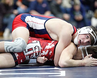 Austintown Fitch's Gus Sutton and Beaver Local's Jared Wright at the EOWL wrestling finals at Austintown Fitch High School on Saturday afternoon. EMILY MATTHEWS | THE VINDICATOR